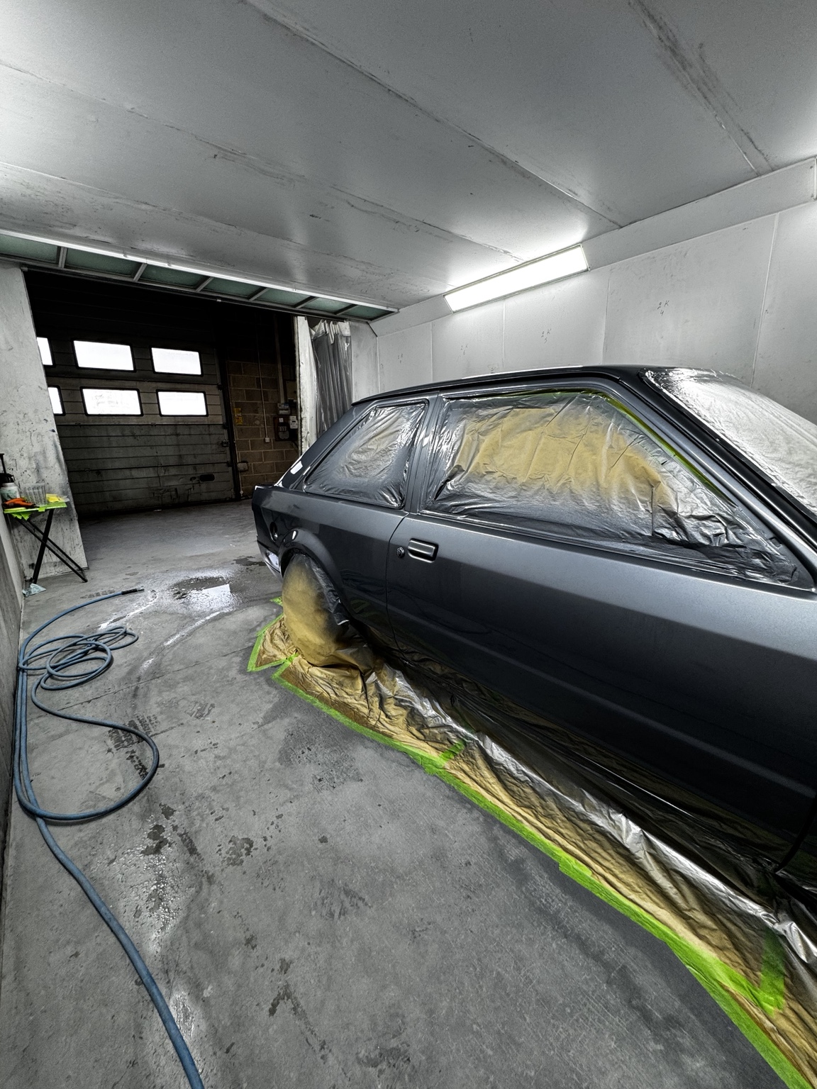Classic Volkswagen being refinished in the spray booth