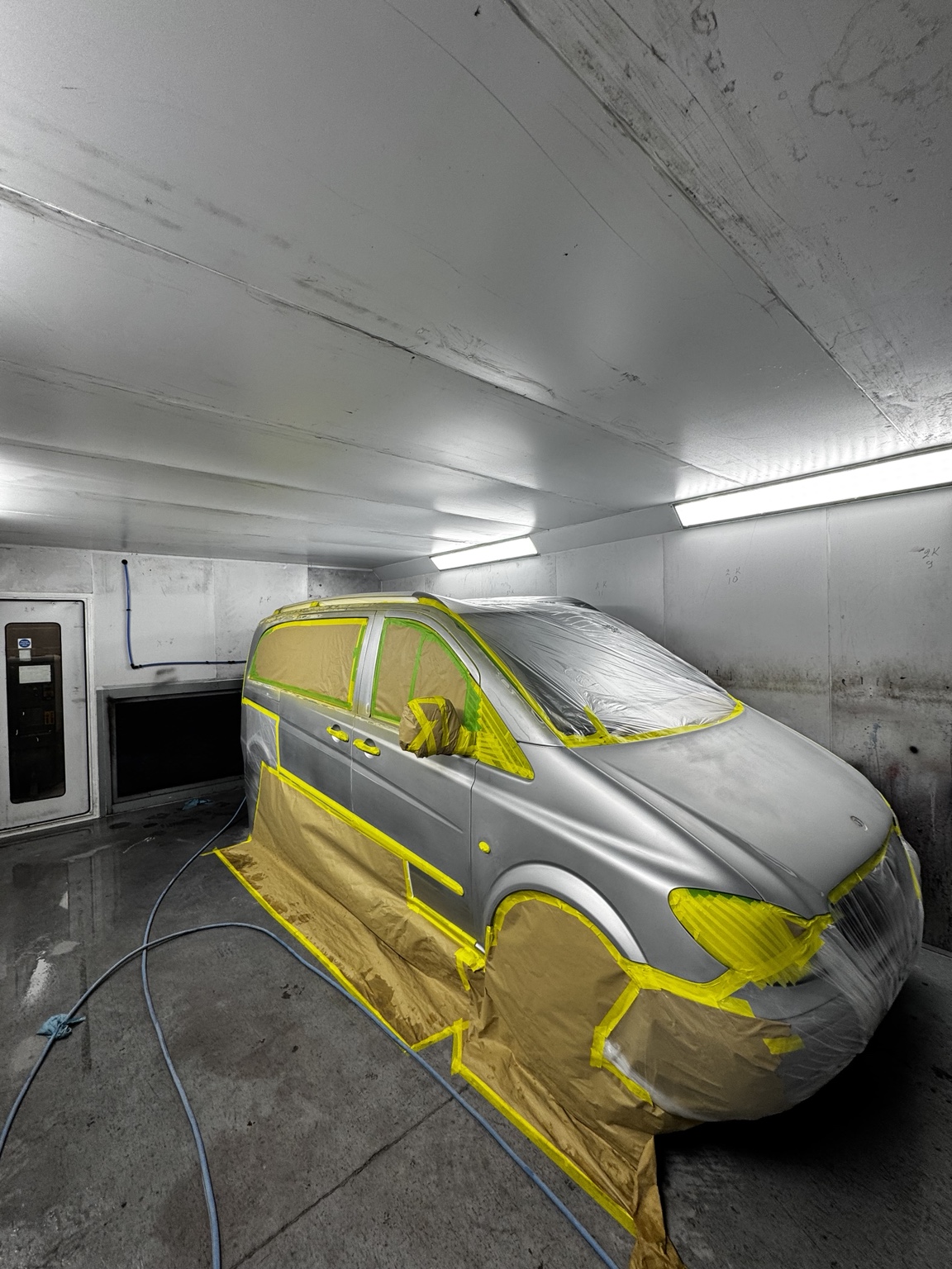 Vehicle masked and prepared for painting