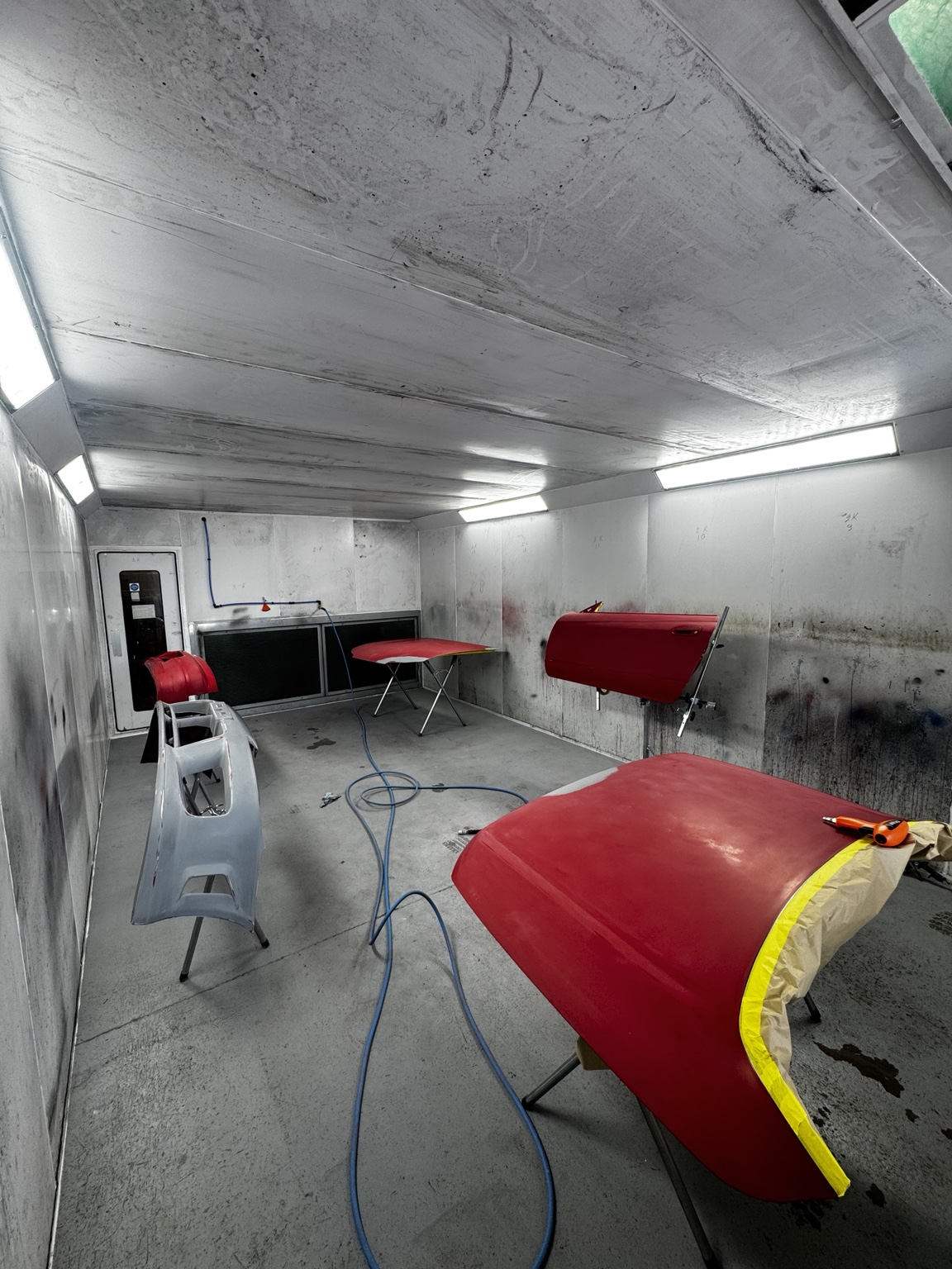 Vehicle preparation inside spray booth