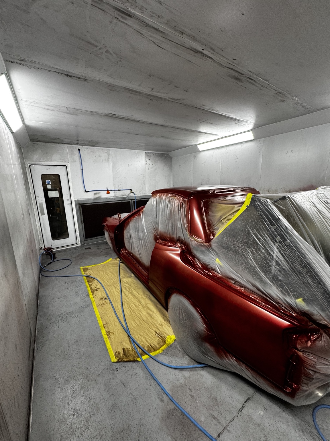 Fresh red paintwork in the spray booth